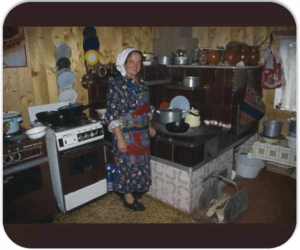 20061566. UKRAINE Carpathian Mountains Hutsul woman in kitchen