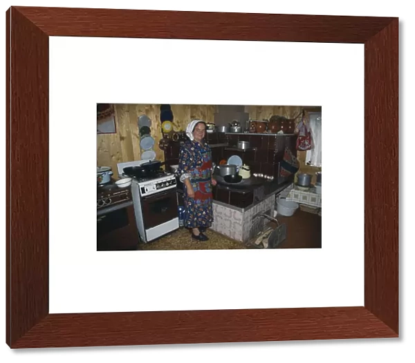 20061566. UKRAINE Carpathian Mountains Hutsul woman in kitchen