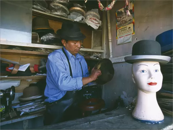 20049585. BOLIVIA La Paz El Alto La Ceja. Hatmaker making traditional bowler style hats