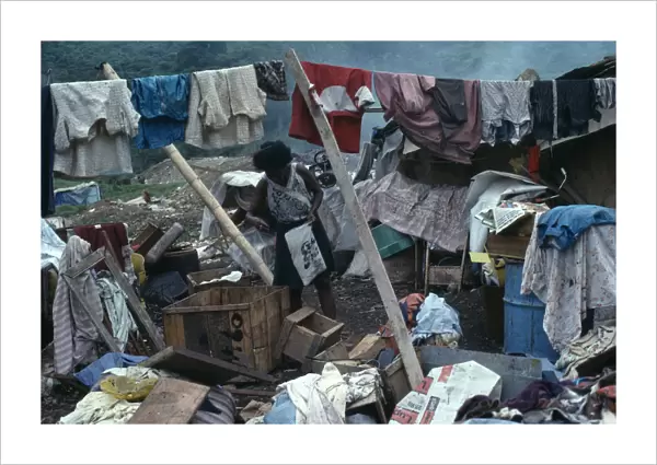 ECUADOR, Guayas Province, Guayaquil Rubbish sorters house with a woman surrounded by