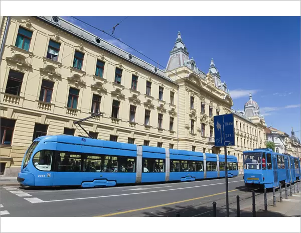 Croatia, Zagreb, Old town, Mihanoviceva Street, Hz Vuca Vlakova national railway headquarters with tram apssing by