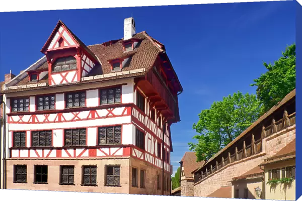 Germany, Bavaria, Nuremberg, Albrecht Durer Haus, Home of the German Renaissance artist with city ramparts behind