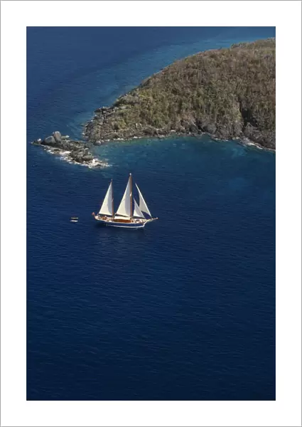 WEST INDIES, US Virgin Islands, St Thomas Elevated view over sailing boat passing
