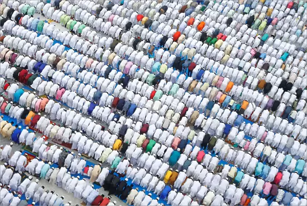 Muslims offer Eid al-Fitr prayers marking the end of the holy fasting month Ramadan
