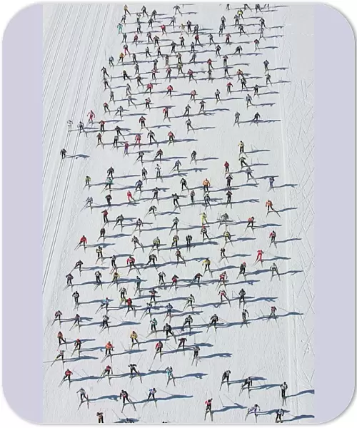 Aerial view of cross country skiers racing over the frozen Lake Sils during the Engadin