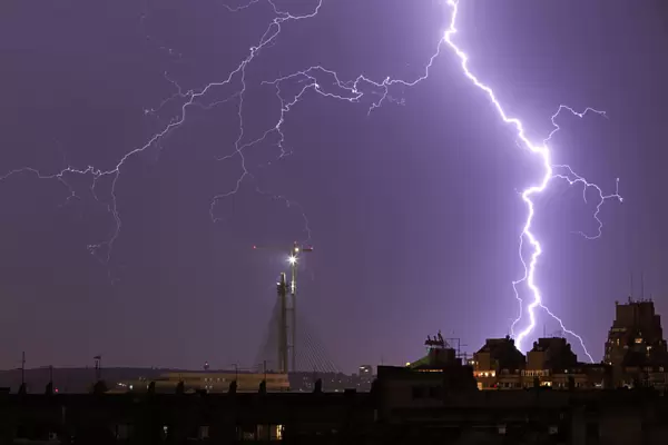 Lightning strikes over buildings during a thunderstorm in Belgrade