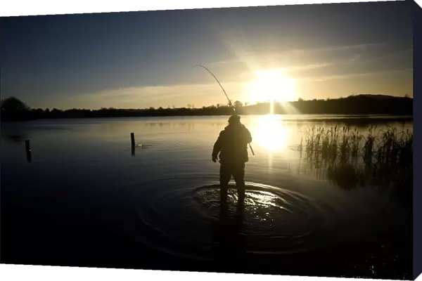 A man is seen fishing at sunset in Lavey Lough near Cavan