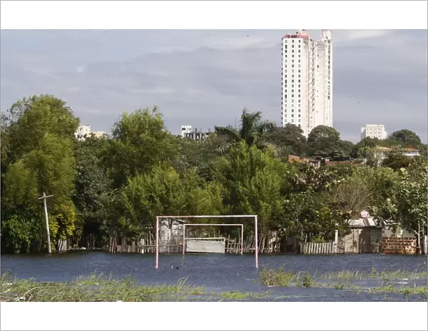 Goalposts stand in a soccer field flooded by the waters of the Paraguay River in Asuncion