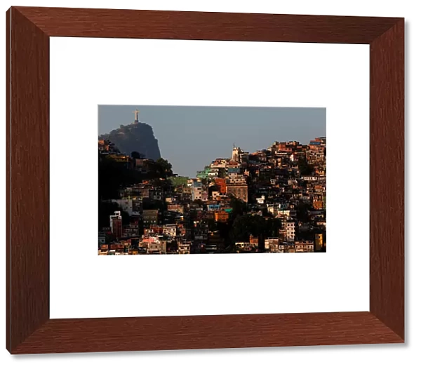 A view of the Rocinha slum with the Christ the Redeemer statue in the background