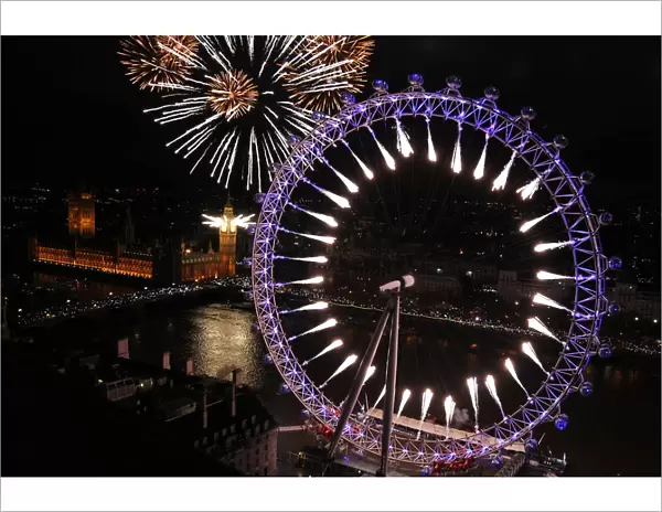 Fireworks explode from The Big Ben clock tower and the London Eye during New Year
