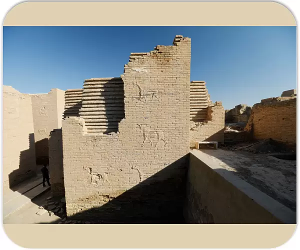 A man walks in the ancient city of Babylon near Hilla
