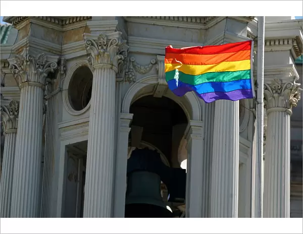 A rainbow flag flies over the Brooklyn Borough Hall in the Brooklyn borough of New York