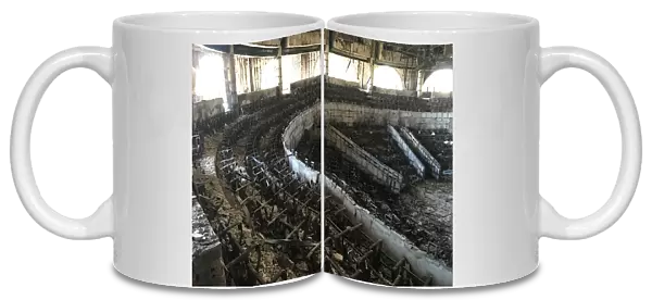 The charred interior of the parliament is seen after it was burned in post-election