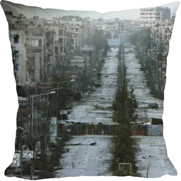 A general view shows a damaged street with sandbags used as barriers in Aleppos Saif