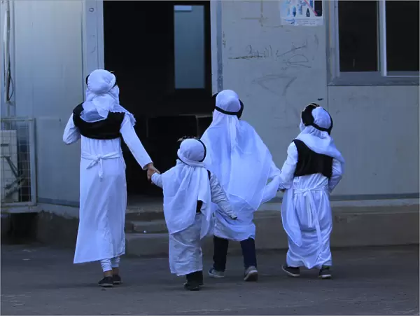 Yazidi students are seen at school in Sharya camp, in Duhok