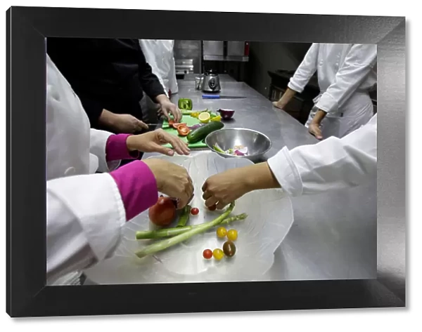 Students take a vegetarian cooking class with Chef Jesus Serrano at the Institute of