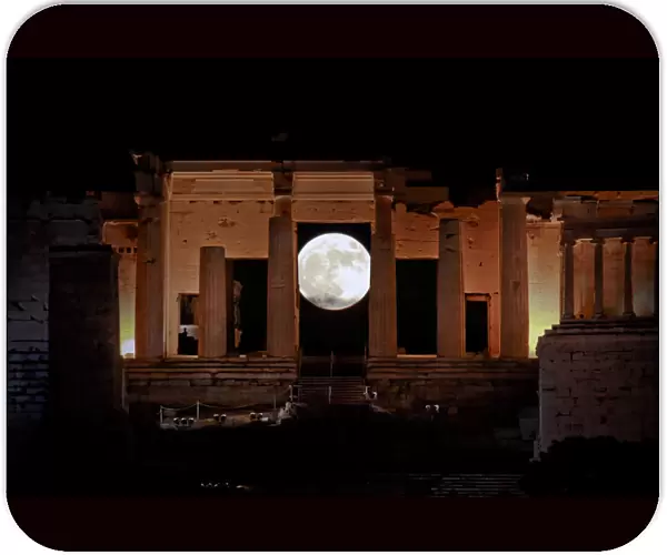 A rising supermoon is seen through the Propylaea, the ancient Acropolis hill gateway