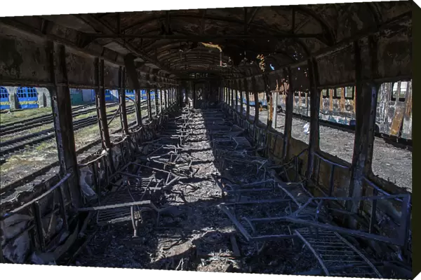 Interior of a burnt-out train is pictured at a railway station in the town of Ilovaysk