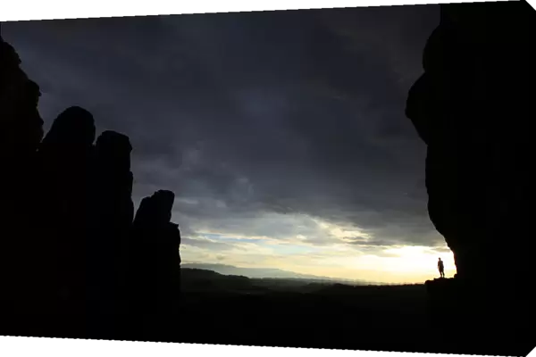 Hiker rounds Cathedral Rock at sun set in Sedona, Arizona