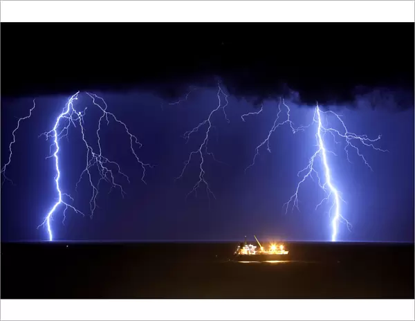 Lightning strikes over the Mediterranean sea during a rainstorm near the city of Ashkelon