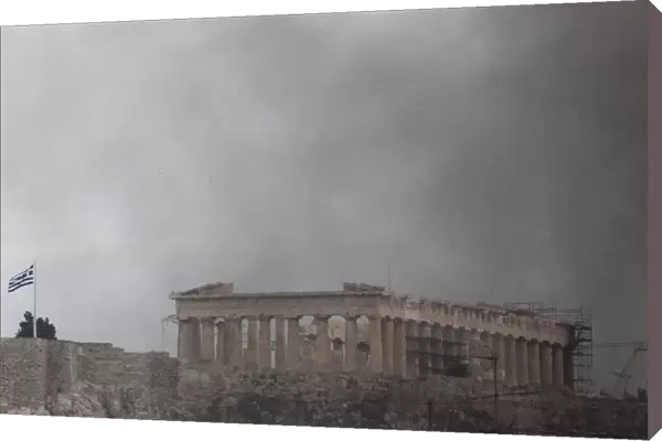 The Parthenon surrounded by smoke in Athens