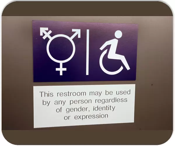 A sign is seen on a gender neutral toilet during the World Economic Forum annual meeting