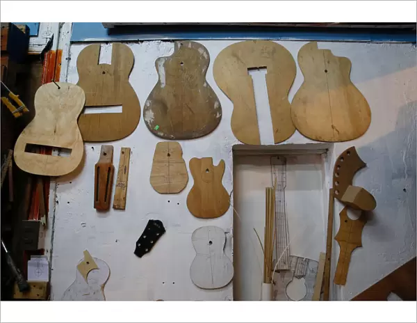 Molds for the manufacture of guitars, are displayed inside a workshop of instruments at