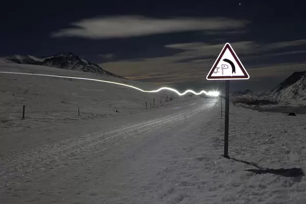 The headlight of a musher is pictured during the tenth stage of La Grande Odyssee sled
