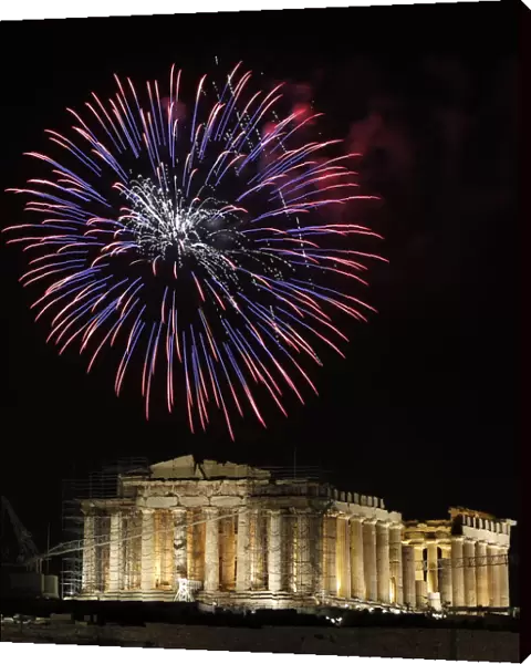 Fireworks explode over the temple of the Parthenon during New Years day celebrations in