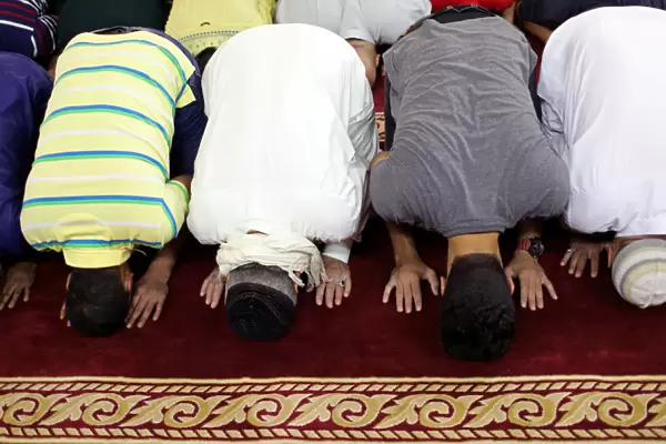 Sunni Muslims perform Eid al-Fitr prayers marking the end of the holy fasting month of