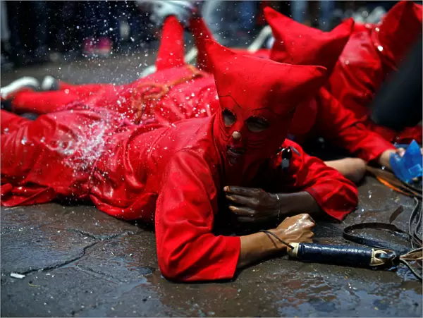 Men dressed as demons participate in a ceremony known as Los Talciguines