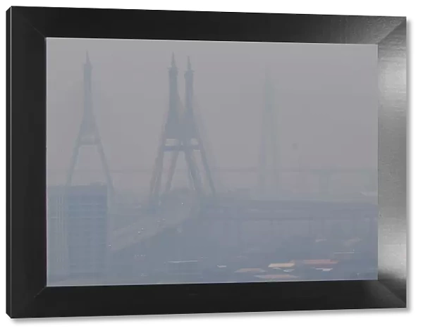 The Bhumibol bridge is seen through air pollution in Bangkok
