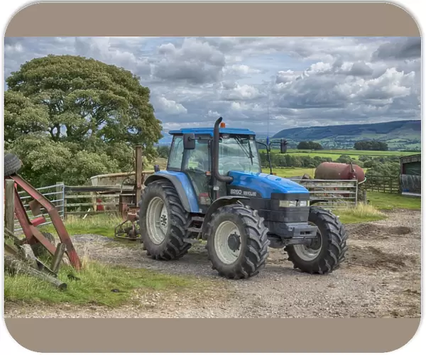 New Holland 8260 tractor in farmyard, Lancashire, England, August