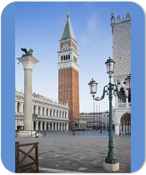 View of city square with Lion of Saint Mark on column and belltower of Roman Catholic cathedral, Leone Di San Marco