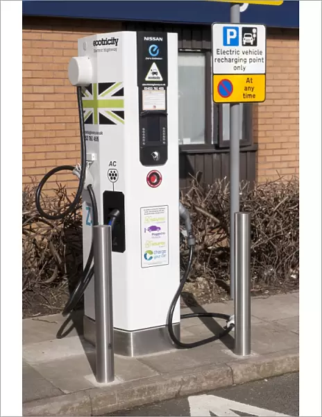 Recharging point for electric cars at motorway service area, England, April