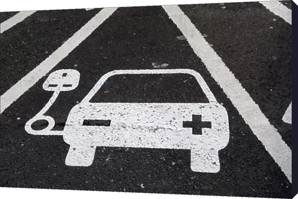 Reserved parking bay at recharging point for electric cars at motorway service area, England, April