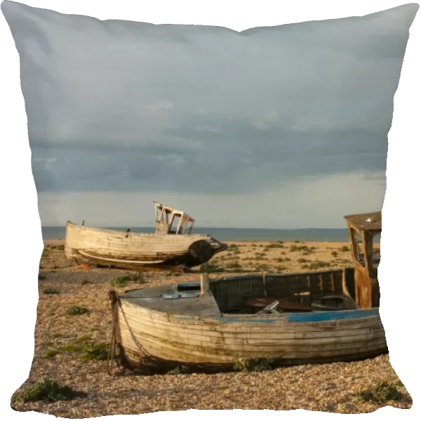 Abandoned fishing boats on shingle beach, Dungeness, Kent, England, April
