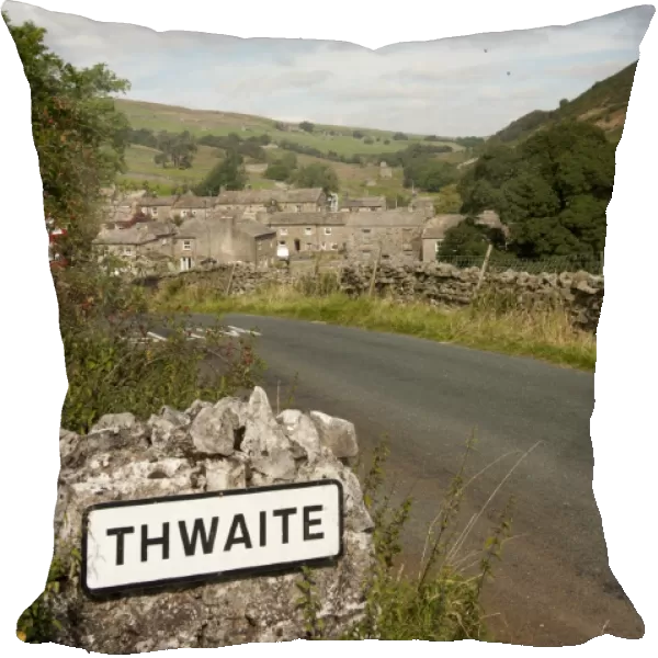 Sign beside road into village, Thwaite, Swaledale, Yorkshire Dales, North Yorkshire, England, September
