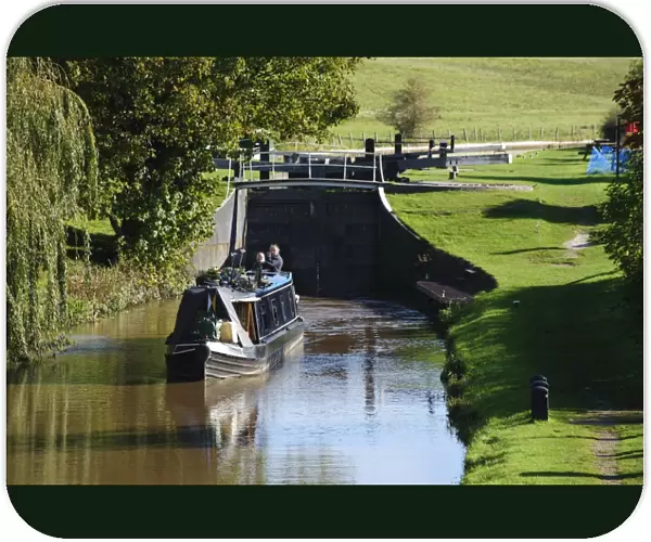 Narrowboat leaving canal lock, built from iron because of sandy soil conditions, Beeston Iron Lock