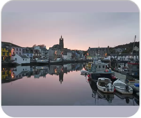 Boats moored in town harbour at sunset, Tarbert, Kintyre Peninsula, Loch Fyne, Argyll and Bute, Scotland, october