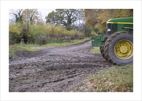 John Deere tractor beside muddy country road, Welshpool, Powys, Wales, November
