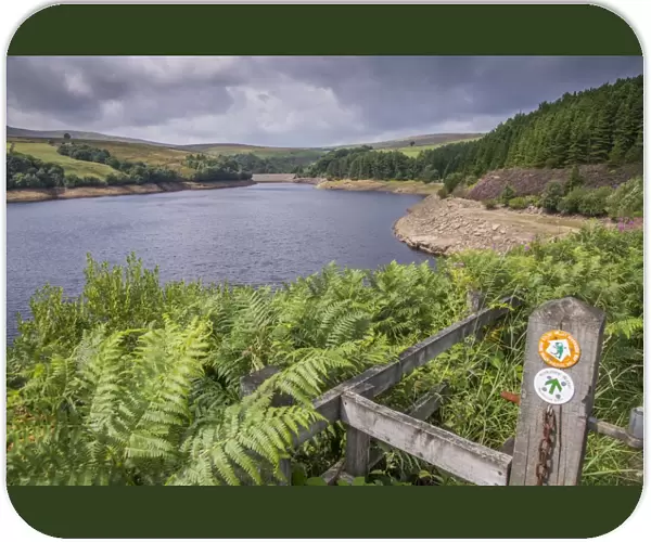View of manmade reservoir with Holme Valley Riverside Way and Yorkshire Water Permissive Path signs, Digley Reservoir