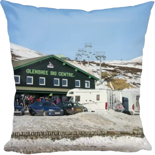 Ski resort carpark, buildings and chairlift in snow, Glenshee Ski Centre, Grampian Mountains, Aberdeenshire, Highlands