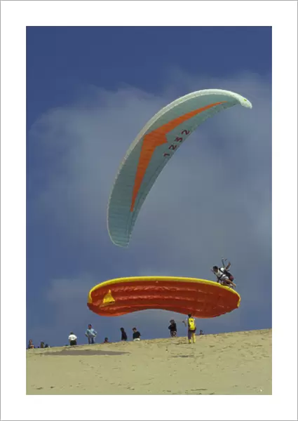 Europe, France, Aquitania, Dunes du Pilat. Paragliding on atlantic coast