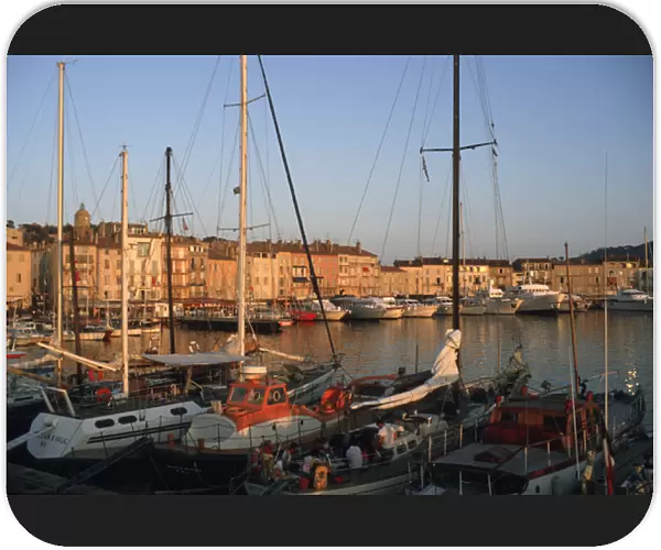 Europe, France, St. Tropez Ships in port and city skyline