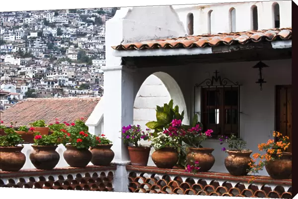 South America, Mexico, Taxco. Close-up of a home with other houses on hillside. Credit as