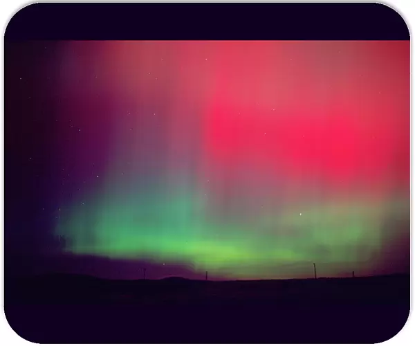 Aurora borealis, northern lights at midnight east of Boise, Idaho following an unusually