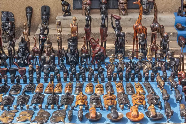 West Africa, The Gambia, Banjul. Wooden masks, animals, and other crafts for sale