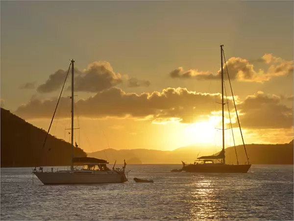 British Virgin Islands, Tortola. Caribbean sunset with sailboats at Sopers Hole