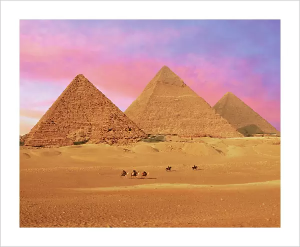 Egypt, Cairo, Giza, View of all three Great Pyramids at sunset